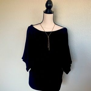 Bateau neck, kimono sleeves, subtle sparkle.